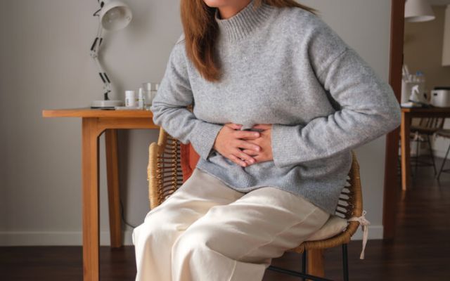 a-sick-woman-suffering-from-stomachache-abdominal-2024-12-02-13-35-18-utc (1)