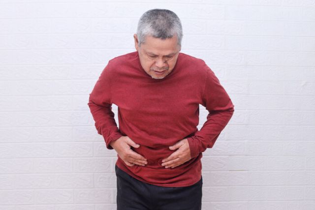 asian-senior-man-suffering-stomach-ache-2025-03-16-07-53-42-utc (1)