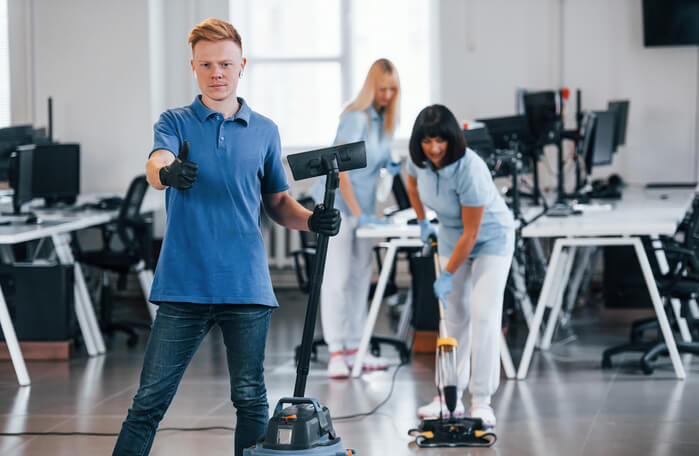 guy-with-vacuum-cleaner-group-of-workers-clean-mo-2025-03-18-20-27-08-utc (1) (1)