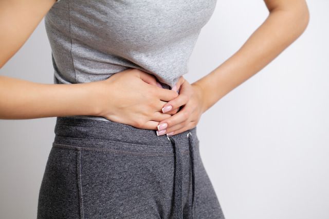 woman-feels-pain-in-the-abdomen-holding-the-place-2025-02-12-06-12-11-utc (1) (1)